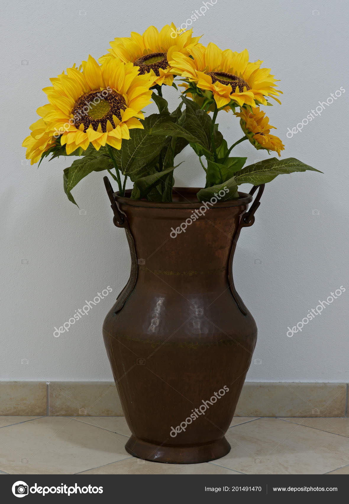 artificial sunflowers in vase