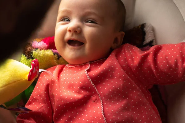 Happy little baby girl smiles — Stock Photo, Image