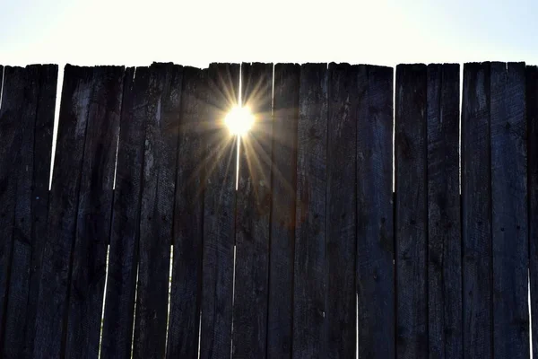 Rays Sun Shine Cracks Wooden Fence ストックフォト