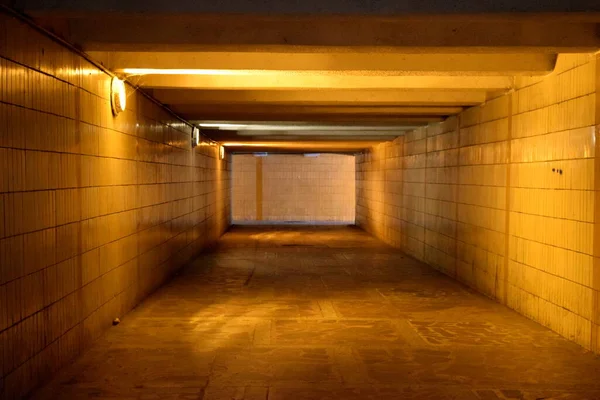 Underpass Tunnel Lit Orange Light People — Stock Photo, Image