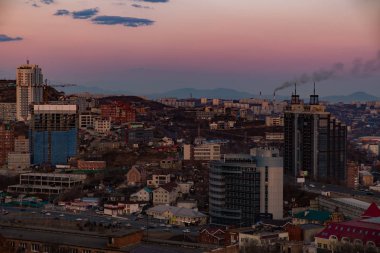 Panoramic view of the city of Vladivostok against the sunset.