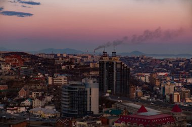 Panoramic view of the city of Vladivostok against the sunset.
