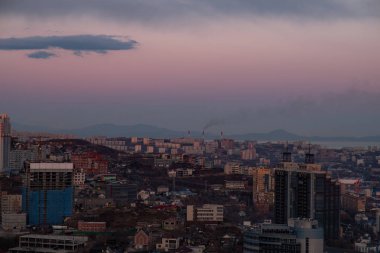 Panoramic view of the city of Vladivostok against the sunset.