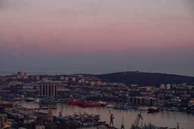 Panoramic view of the city of Vladivostok against the sunset.