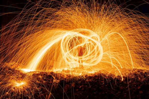 Drawing light at night in an old abandoned building, splashes of light and sparks. Freezelight. — Stock Photo, Image