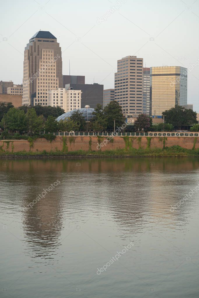 The Red River meanders by under bridges and by the waterfront in Shreveport Louisiana                              
