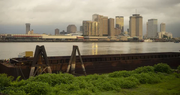Cloudy skies start to clear after a storm making a dark background behind the buildings of New Orleans Louisiana