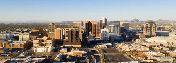Late afternoon sun lights the buildings in the downtown urban core of Phoenix Arizona