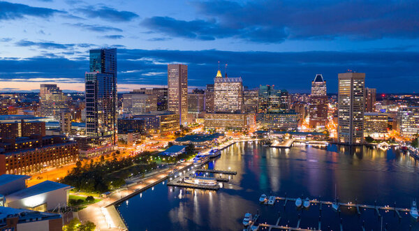 The buildings are illuminated in the downtown urban core of Baltimore Maryland