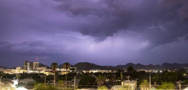 Electrical Storm Lightning Striking over Downtown Tucson Arizona clipart