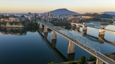 Sunrise comes to Lookout Mountain standing behind Downtown Chattanooga