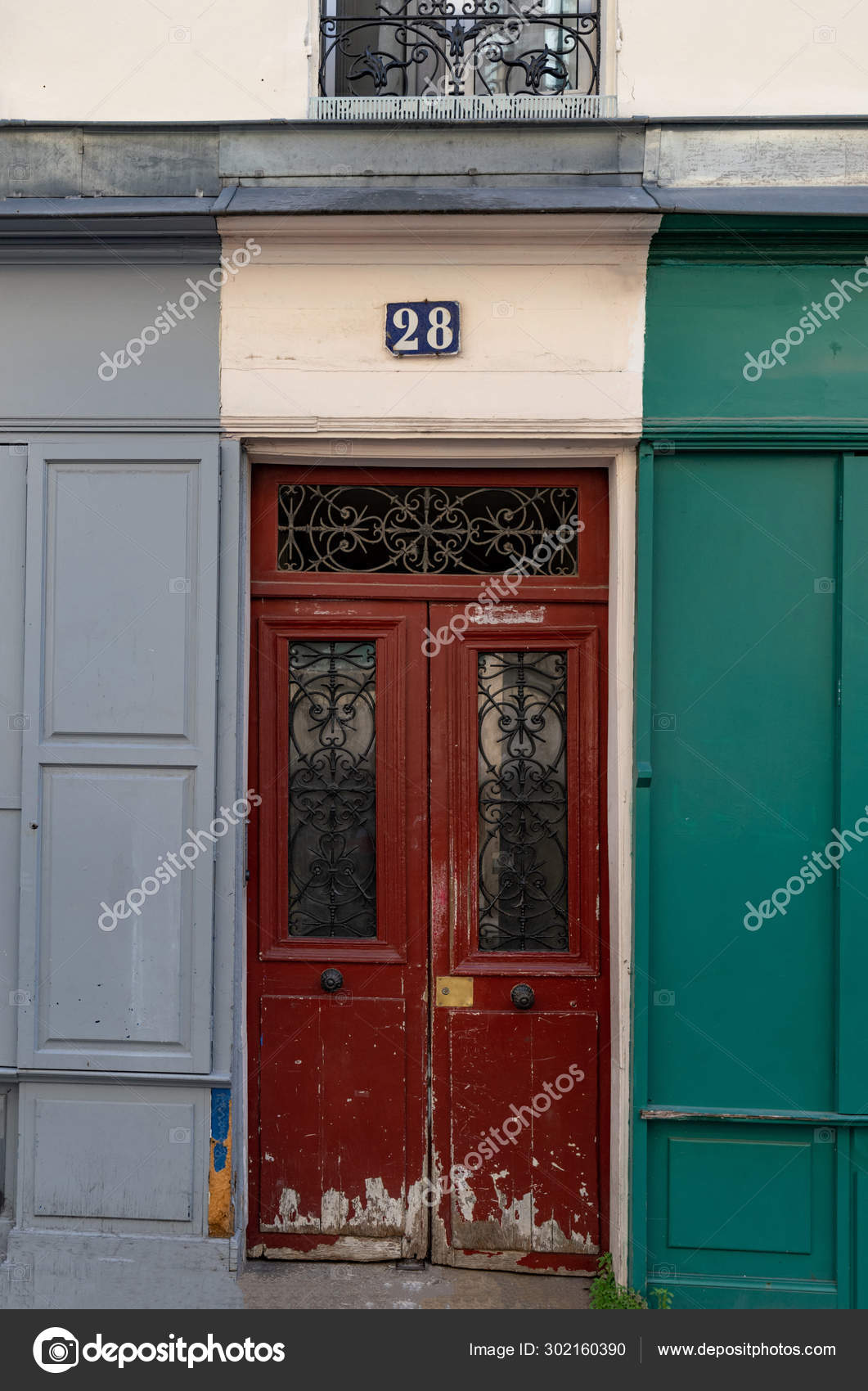 Shabby Dark Red Door Ornate Metal Gratings House Facade