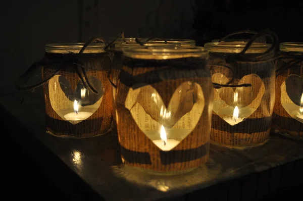 Jars Hearts Burning Candles Dark — Stock Photo, Image