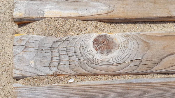 Wooden path on sand beach