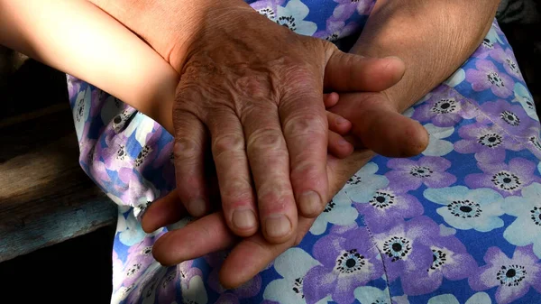 Elder Woman Hold Child Hand Her Wrinkled Aged Hands Diverse — Stock Photo, Image