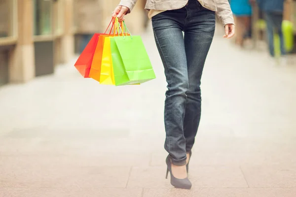 Beautiful young woman shopping in the city, mall with shopping bag, happy shopping tour