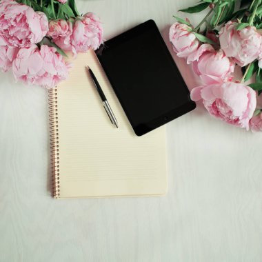 flat lay concept with tablet, writing pad, pen and beautiful peonies, can be used as background clipart