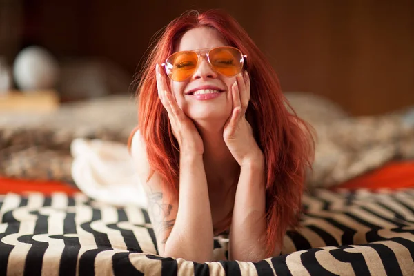 Pretty Young Woman Red Hair Sunglasses Lies Relaxed Laughing Couch — Stock Photo, Image