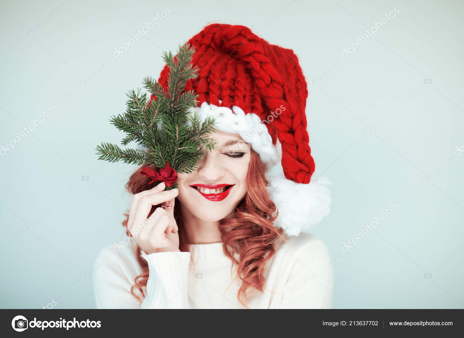 Santas Little Helper Beautiful Happy Young Woman Santa Claus Hat Stock Photo Image By C Piolka