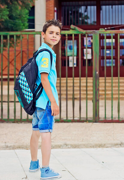 Child goes to school with his backpack