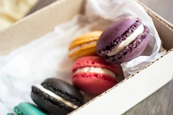 Assorted Colorful French Macaroons Cardboard Box Rustic Wooden Table — Stock Photo, Image