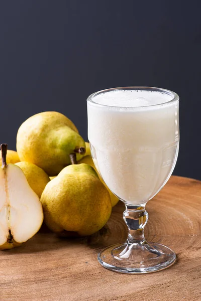 Pear Juice. Some pears together on wooden background.