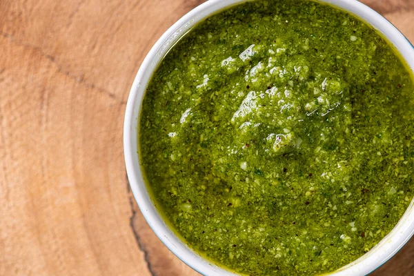 Pesto Sauce Bowl Wooden Table Selective Focus Top View Isolated — Stock Photo, Image