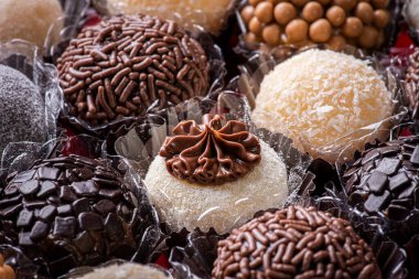Brigadeiro. Typical Brazilian sweet. Many types of brigadiers together. clipart