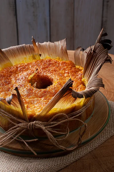 Corn cake in the straw. Homemade cake. Typical of Brazil and South America.
