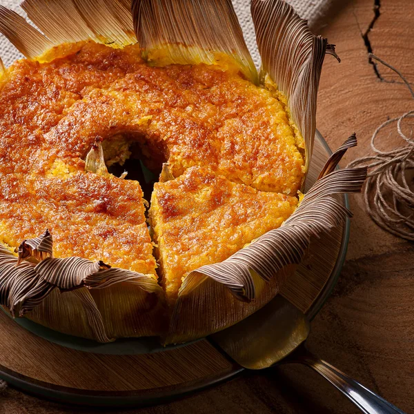 Corn cake in the straw. Homemade cake. Typical of Brazil and South America.