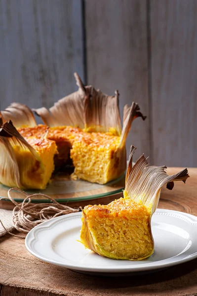 Corn cake in the straw. Homemade cake. Typical of Brazil and South America.