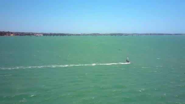 Camera Shows Surfer Figure Sailing Turquoise Ocean Waves Foamy Track — Stock Video