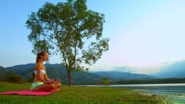 Young Woman Sitting Carpet Meditating River Shore — 비디오
