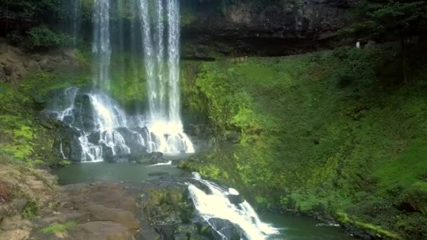 Motion to waterfall bottom across cascade — Stock Video