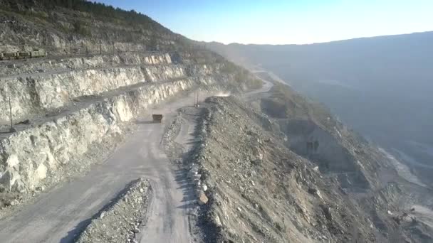 Upper view lorry on track near railway in asbestos quarry — Stock Video