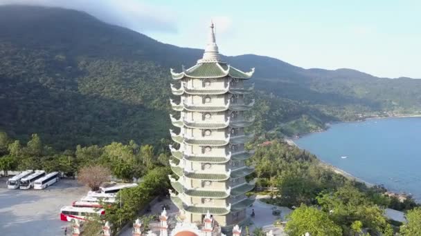 Round motion pagoda with white dome on hilly ocean coast — Stock Video
