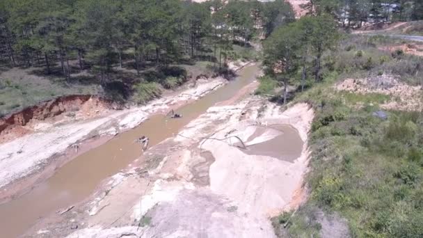 Shallow narrow muddy river used for sand mining upper view — Stock Video