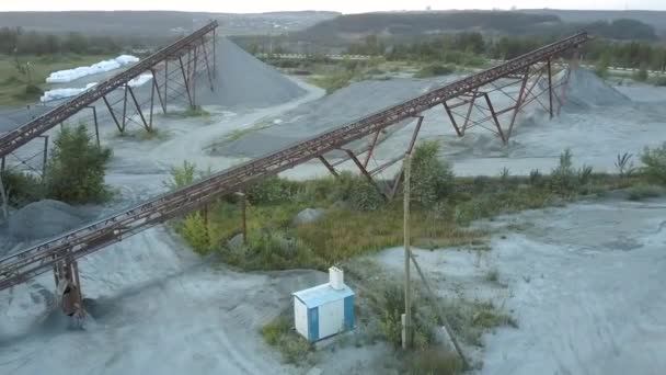 Brown rusty supports at power lines and rubble barrows — Stock Video