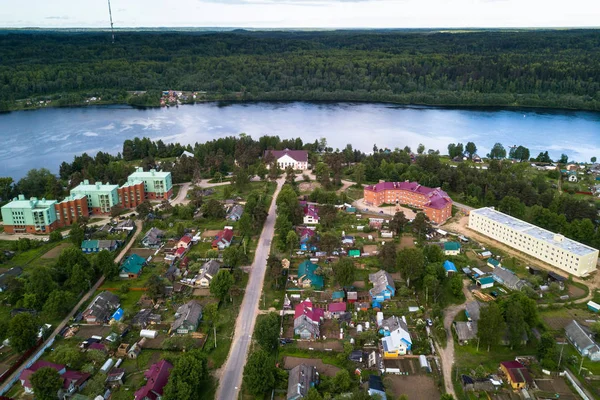 Aerial view of the Svir river and houses in urban-type settlement, Nikolskiy, Leningrad region, Russia.