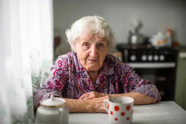 Elderly Russian Woman Sitting Kitchen Table — Stock Photo, Image
