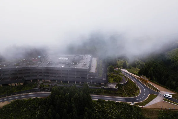 Top view of Abandoned hotel building in the fog on San Miguel island, Azores archipelago, Portugal.