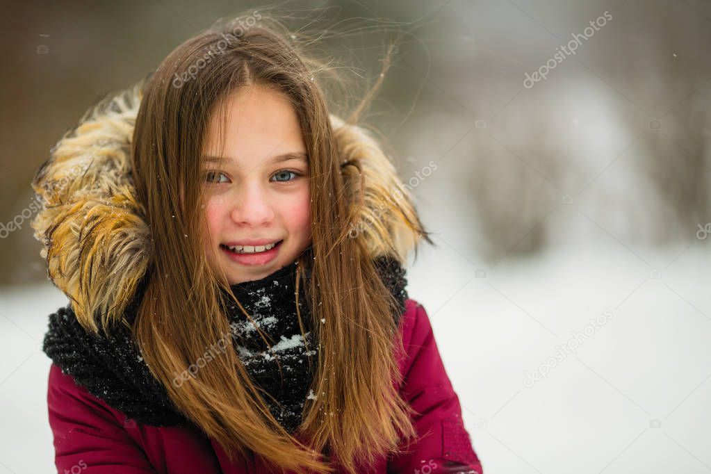 Portrait of a little girl outdoor at winter.