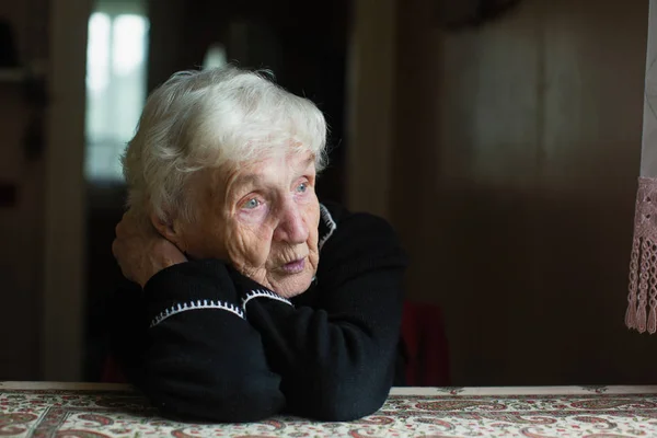 Elderly woman at home. Taking care of lonely old pensioners.