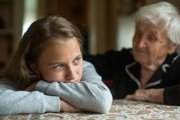 Little Cute Girl Sad Grandmother Soothes Her — Stock Photo, Image