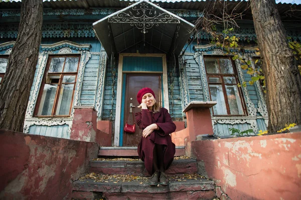 Woman Burgundy Coat Beret Patiently Waiting Sitting Porch Old Wooden — Stock Photo, Image