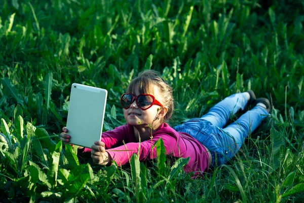 Little Funny Girl Makes Selfie Tablet Green Grass — Stock Photo, Image