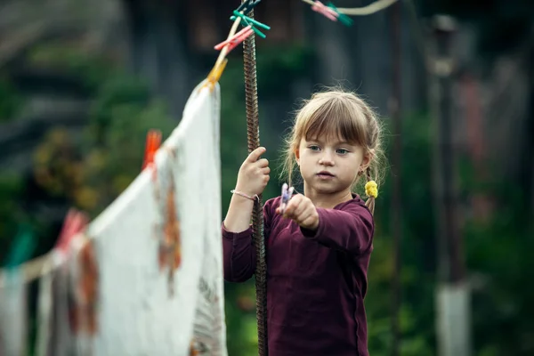 Little Cute Girl Clothespin Outdoor Village — Zdjęcie stockowe