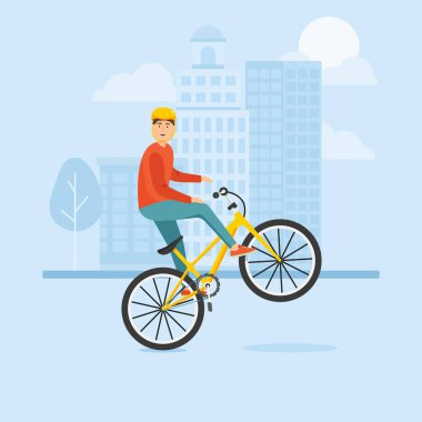 Genç adam bir bisiklet sürmek ve karmaşık stunts gerçekleştirir.