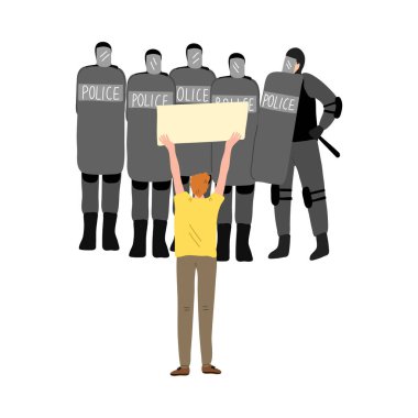 Eylemci genç adam grev sırasında elinde pankartla polise direniyor.