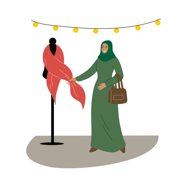 Fille musulmane dans un hijab traditionnel ethnique vert choisir des tissus dans le magasin. Illustration vectorielle en style dessin animé plat. — Image vectorielle